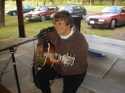 Cathy Cowette, singer and fingerstyle guitar player